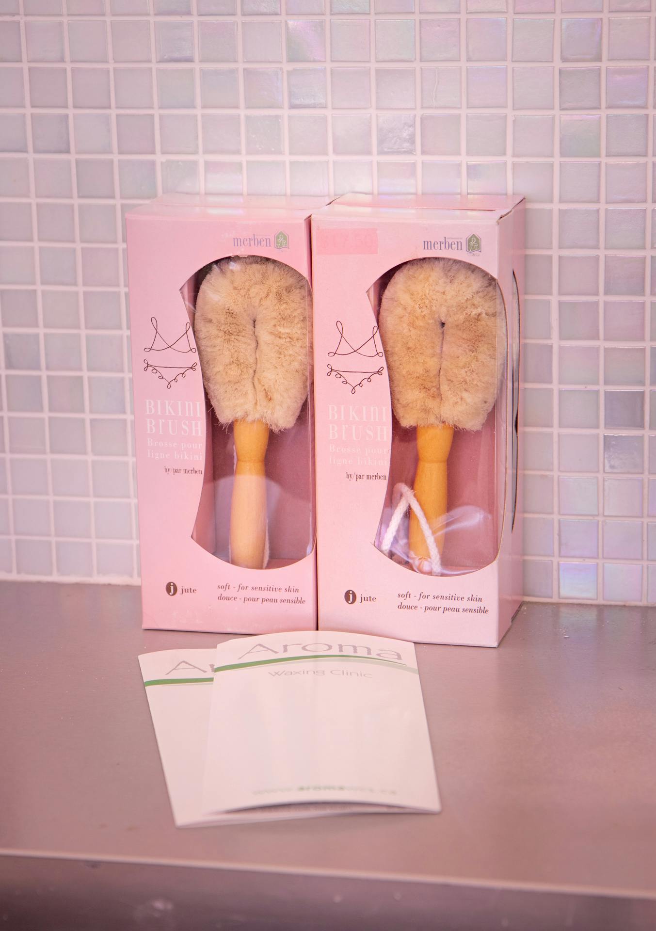 Merben Bikini Brushes in pink boxes on a counter