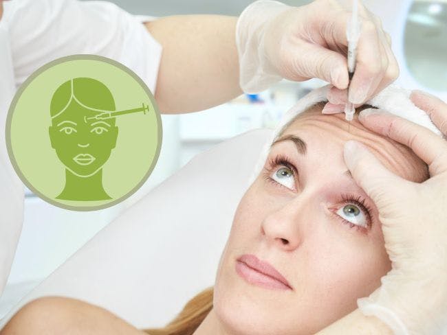 Woman receiving neuromodulator service on her forehead with needle to remove fine lines